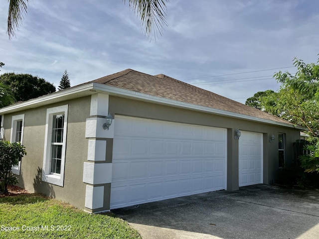 view of property exterior featuring a garage