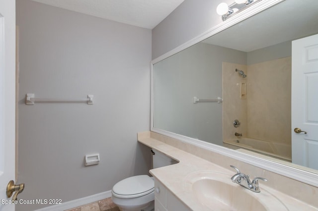 full bathroom featuring vanity,  shower combination, and toilet