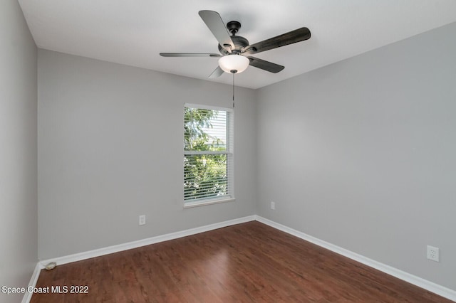 empty room featuring hardwood / wood-style floors and ceiling fan