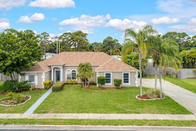 view of front of property with a front lawn