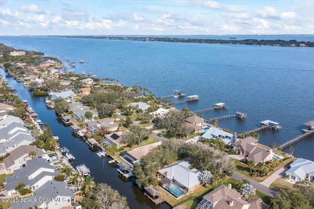 drone / aerial view with a water view