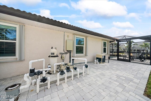 view of patio / terrace with a lanai