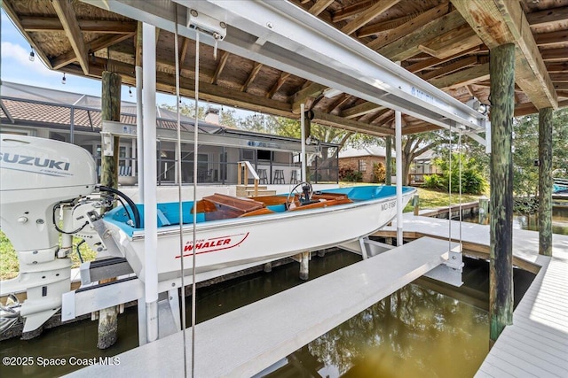 dock area with a water view and glass enclosure