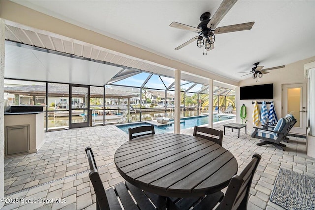 sunroom featuring a pool