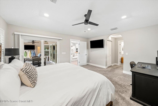 bedroom featuring ceiling fan, light colored carpet, a textured ceiling, and access to outside