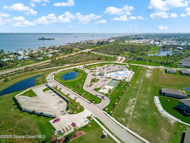 birds eye view of property with a water view