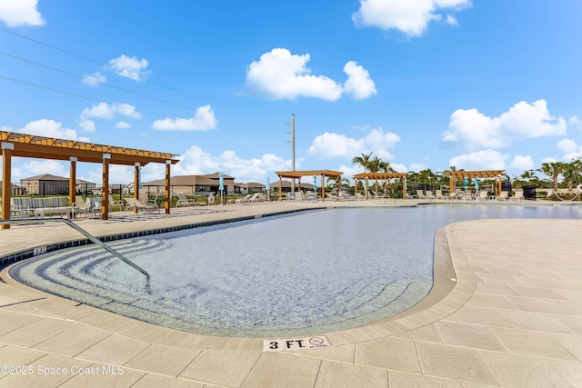 view of swimming pool featuring a pergola