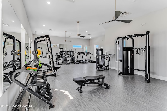 workout area with hardwood / wood-style floors and ceiling fan