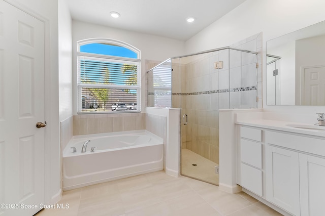 bathroom featuring vanity, separate shower and tub, and tile patterned floors