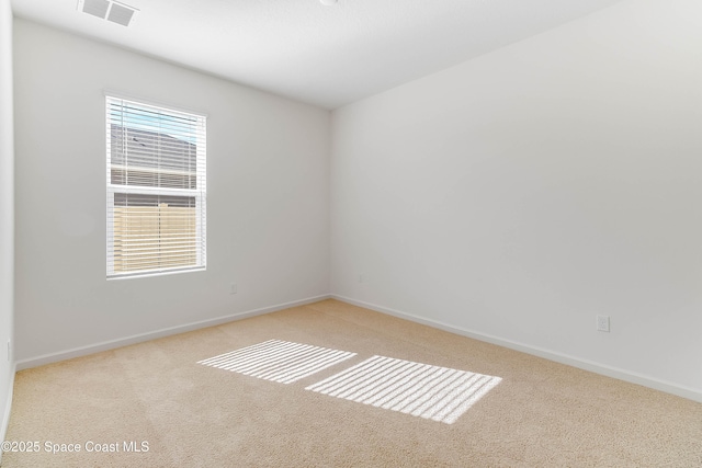 unfurnished room with light carpet