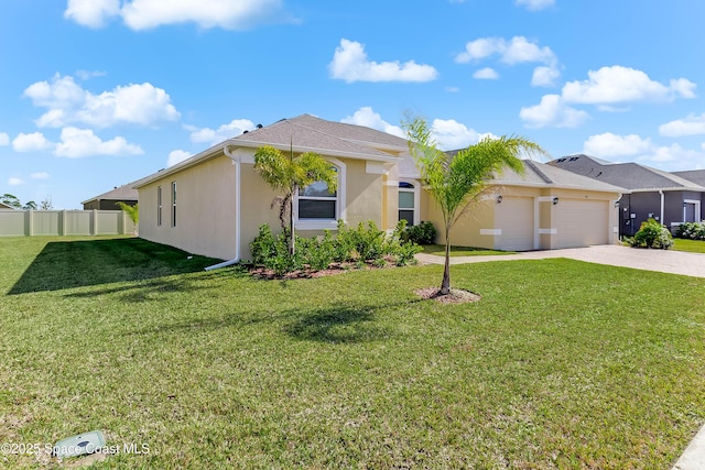 view of front of house with a garage and a front lawn