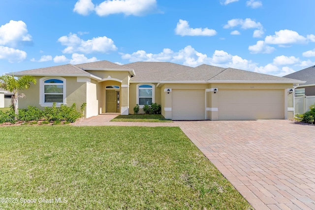 view of front facade featuring a front lawn and a garage