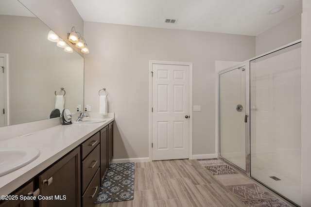 bathroom with vanity and walk in shower