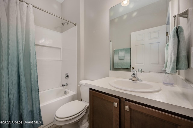 full bathroom featuring shower / tub combo, vanity, and toilet