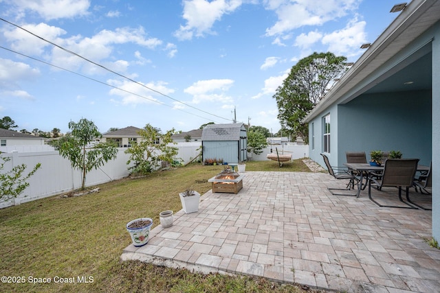 view of patio with a storage unit