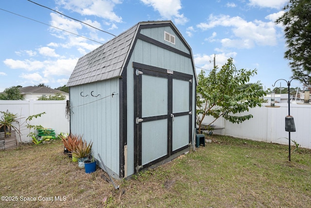 view of outdoor structure with a lawn