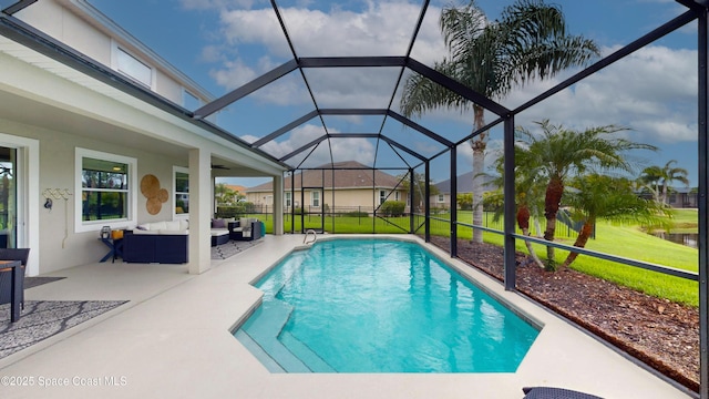 view of swimming pool with a patio area, an outdoor living space, ceiling fan, and glass enclosure