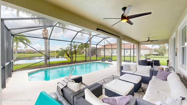 view of swimming pool featuring a patio, a water view, an outdoor hangout area, and a lanai