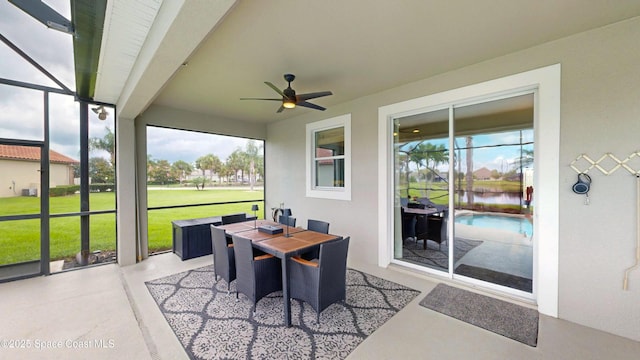 sunroom featuring ceiling fan