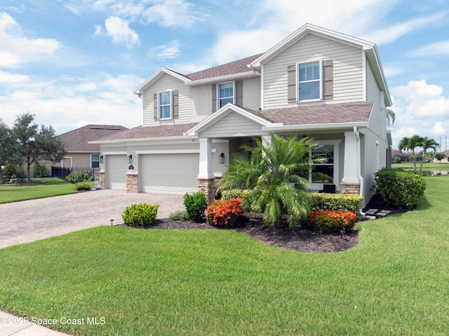 view of front facade featuring a front lawn and a garage