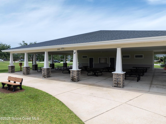 view of property's community featuring a patio area and a yard