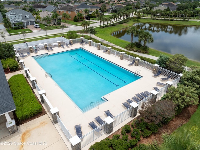 view of swimming pool featuring a water view