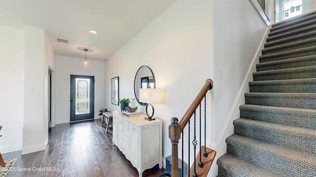 entrance foyer featuring dark hardwood / wood-style floors