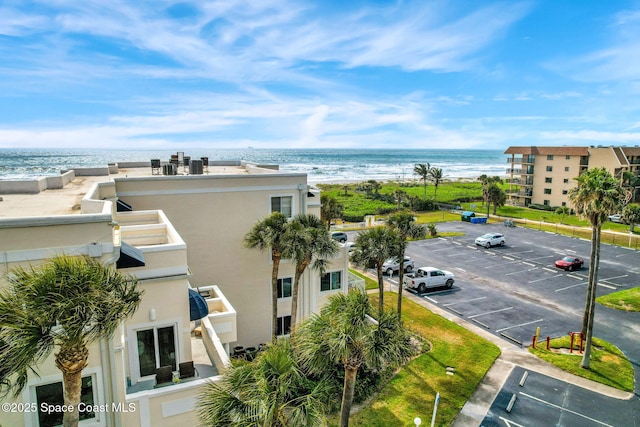 birds eye view of property with a water view