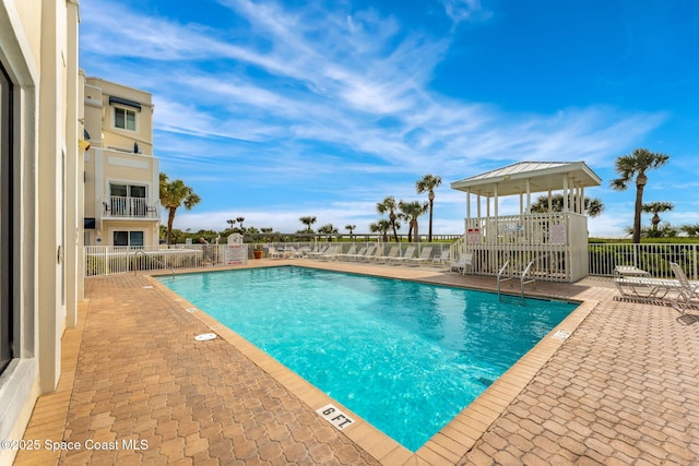 view of swimming pool featuring a patio