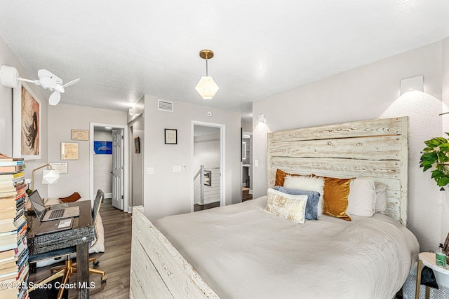 bedroom featuring dark hardwood / wood-style floors