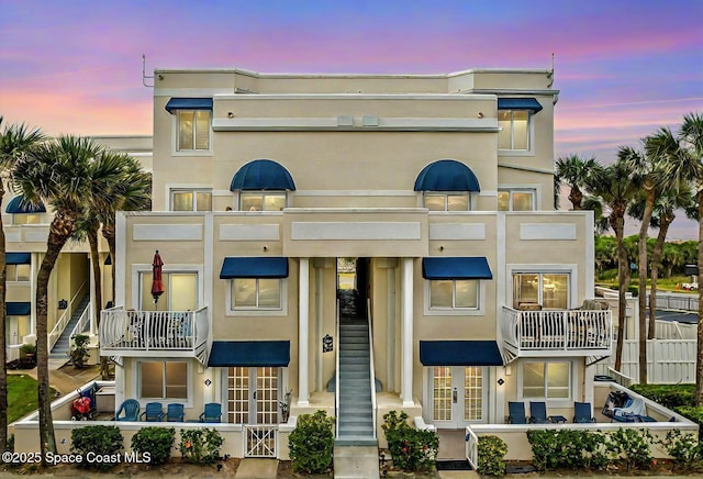 view of outdoor building at dusk