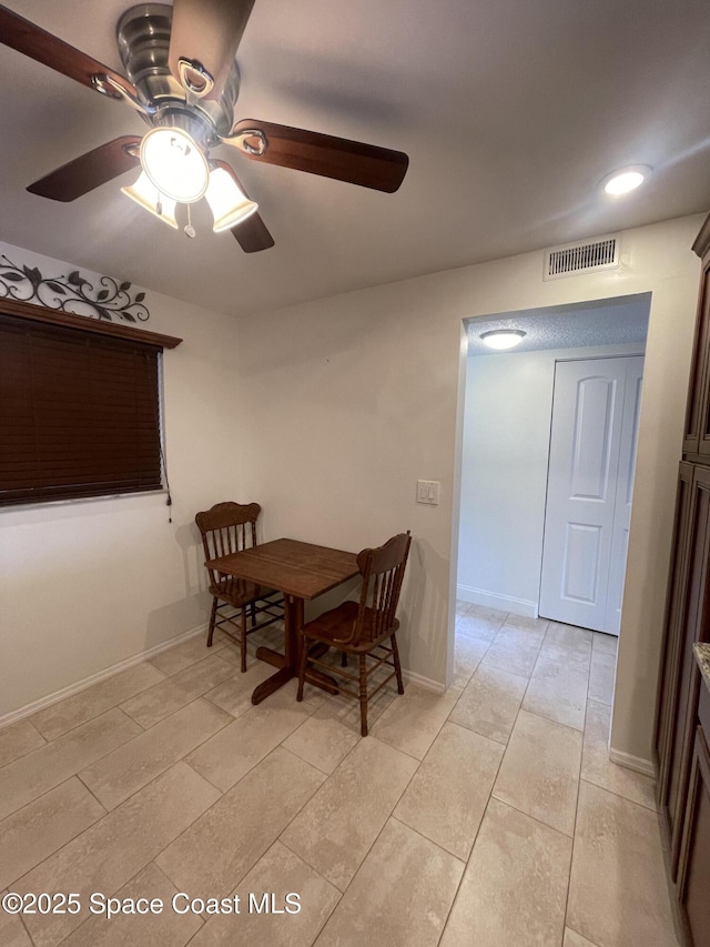 dining space featuring ceiling fan