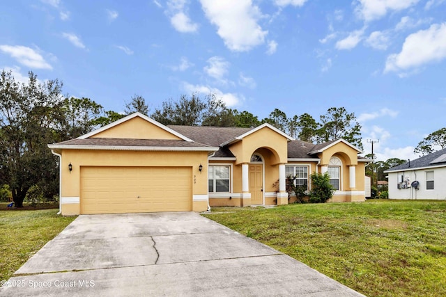 single story home featuring a garage and a front lawn