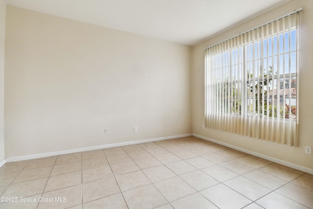 empty room featuring light tile patterned floors