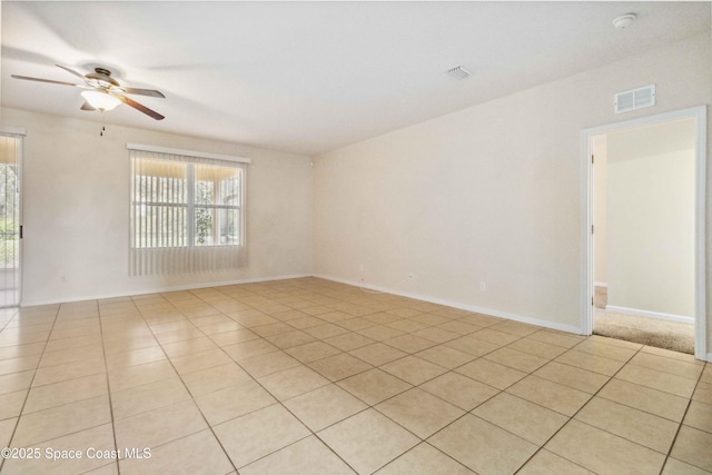 tiled empty room with ceiling fan