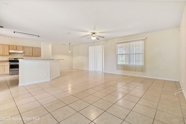 interior space with ceiling fan and light tile patterned floors