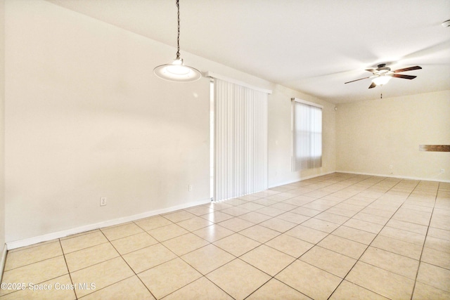 tiled empty room with ceiling fan