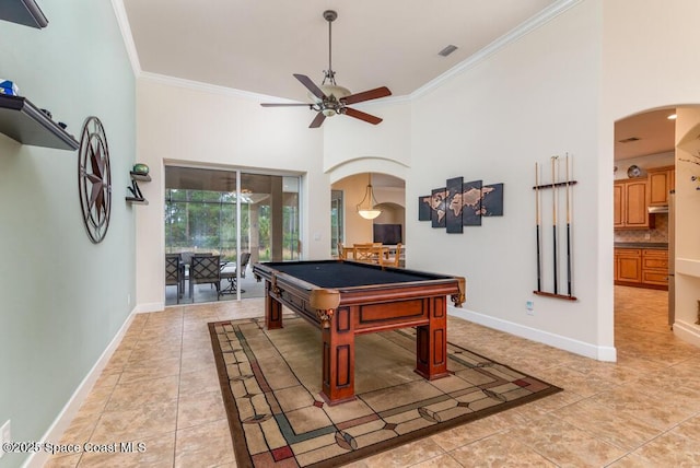 rec room with ceiling fan, crown molding, pool table, and a high ceiling