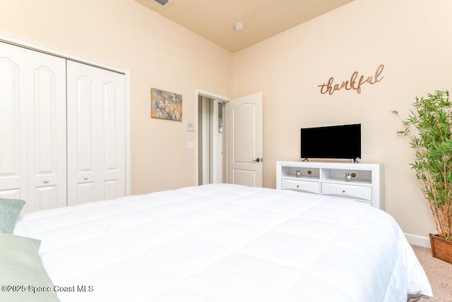 bedroom featuring a closet and carpet flooring