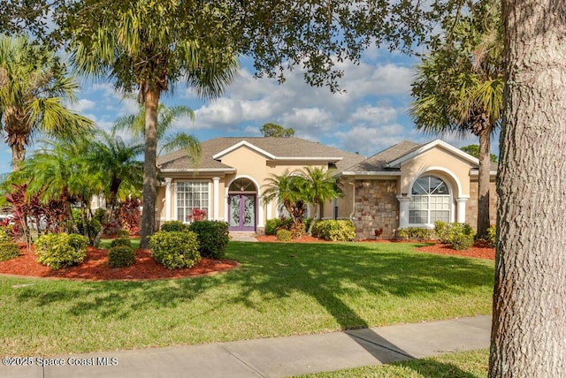 view of front of property featuring a front lawn and french doors