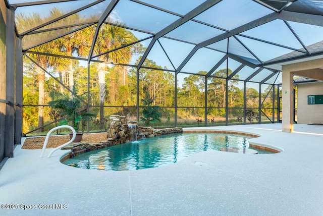 view of swimming pool with a lanai, pool water feature, and a patio area