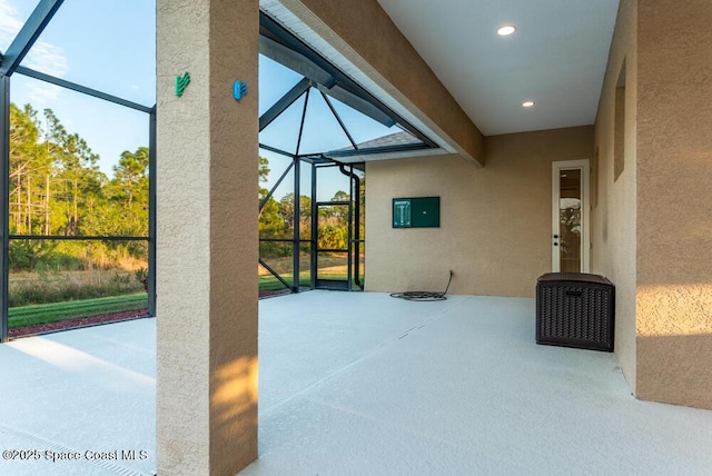 view of patio / terrace featuring glass enclosure