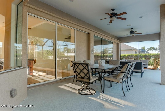 sunroom / solarium with ceiling fan