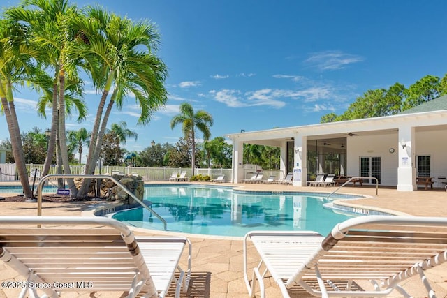 view of pool with ceiling fan and a patio area