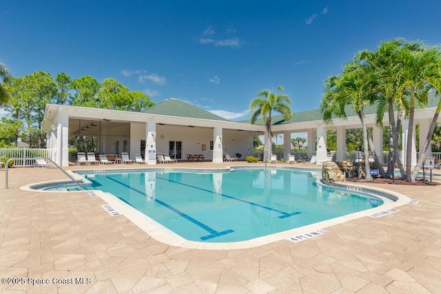 view of swimming pool with a patio area