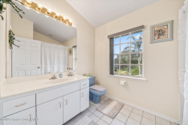 bathroom with vaulted ceiling, tile patterned flooring, vanity, toilet, and a textured ceiling