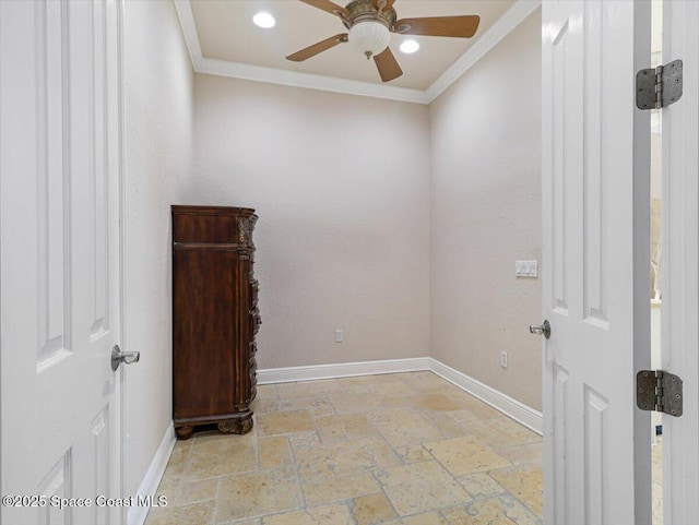 empty room featuring crown molding and ceiling fan