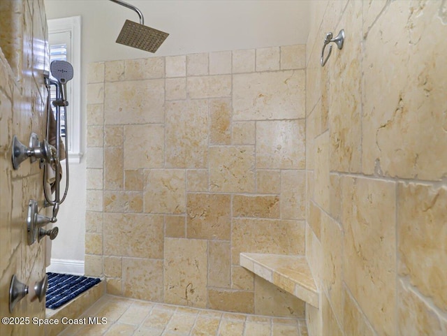 bathroom with a tile shower