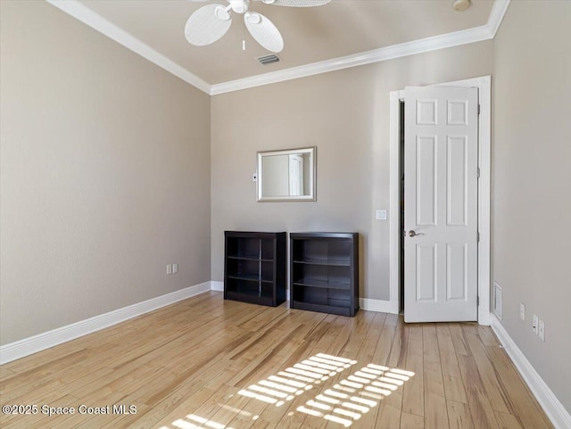 unfurnished bedroom featuring light hardwood / wood-style flooring, ceiling fan, and crown molding