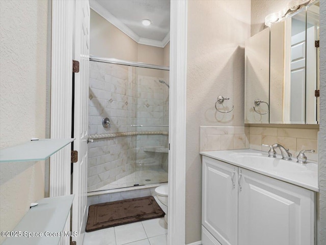 bathroom featuring vanity, crown molding, toilet, tasteful backsplash, and a shower with shower door